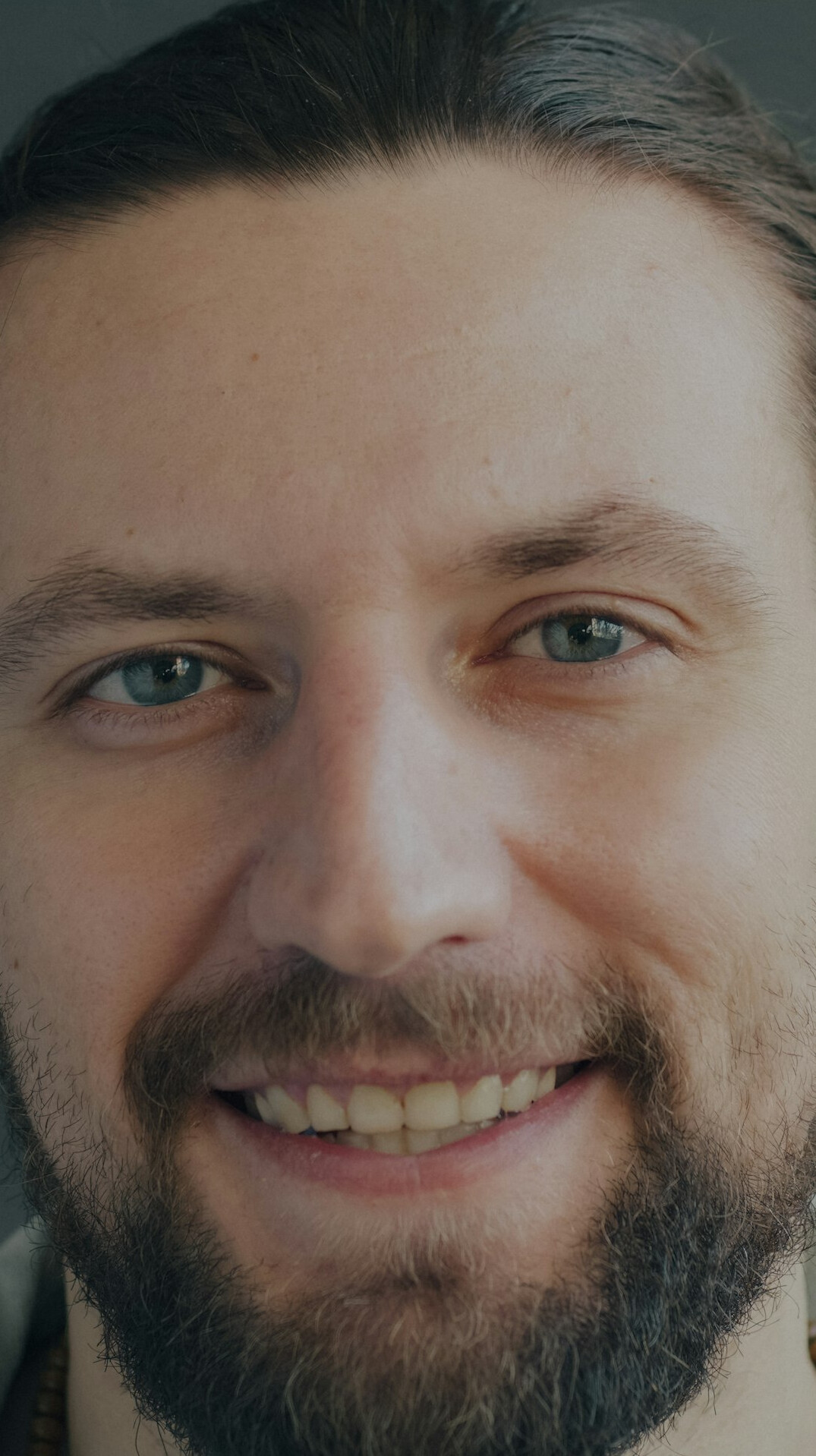 Studio portrait of a young man smiling casually